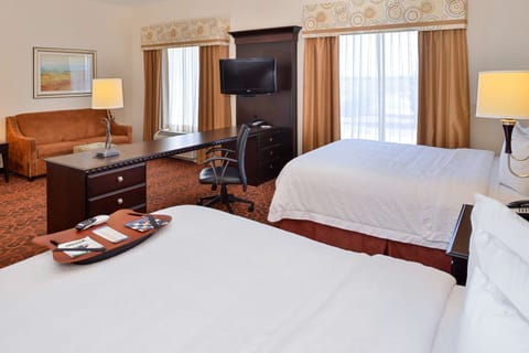 Suite, 2 Queen Beds, Non Smoking | In-room safe, iron/ironing board, free cribs/infant beds