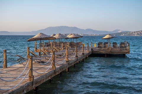 Private beach, white sand, sun loungers, beach umbrellas