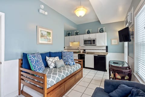 Palm 1 Bedroom Suite | Living area | 38-inch TV with cable channels