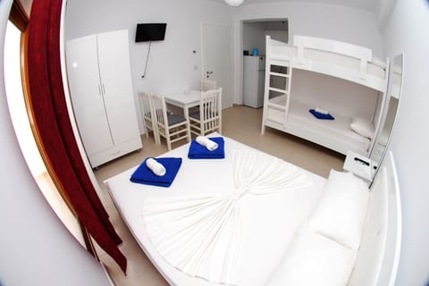 Quadruple Room, Balcony | In-room safe, desk, iron/ironing board, free WiFi