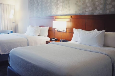 Room, 2 Queen Beds | Desk, blackout drapes, iron/ironing board, free cribs/infant beds