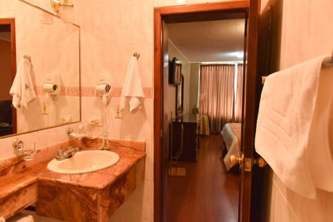 Suite, 1 Queen Bed | Bathroom | Shower, free toiletries, hair dryer, towels