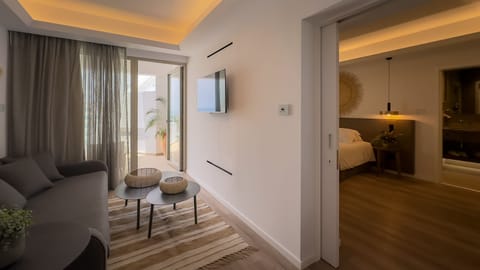 Suite Side Sea view, Pool view | Minibar, in-room safe, laptop workspace, blackout drapes