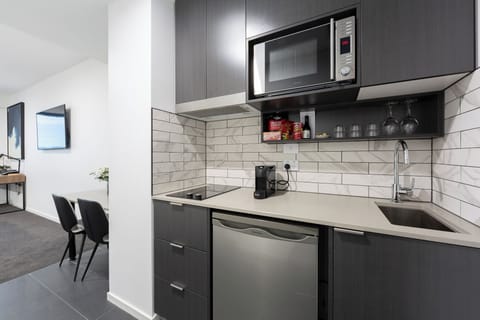 Family Apartment, Multiple Beds | Private kitchenette | Fridge, microwave, stovetop, espresso maker