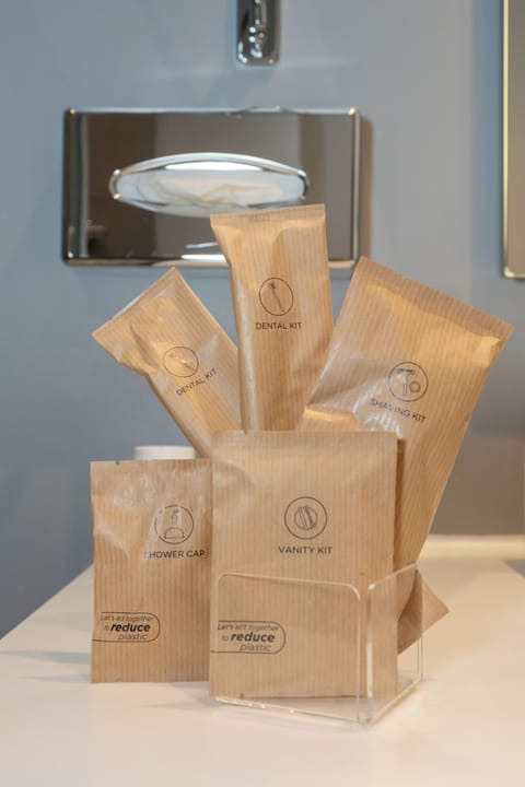 Junior Suite, 1 King Bed | Bathroom | Eco-friendly toiletries, hair dryer, slippers, towels