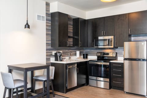 Suite, 1 Bedroom | Private kitchen | Fridge, microwave, oven, stovetop