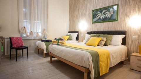 Comfort Triple Room | Select Comfort beds, in-room safe, desk, iron/ironing board