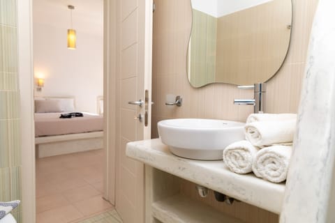 Superior Triple Room | Bathroom | Designer toiletries, towels, soap, shampoo