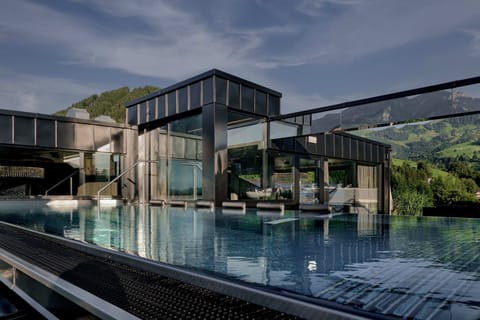 2 indoor pools, 2 outdoor pools, open 7:00 AM to 7:00 PM, pool umbrellas