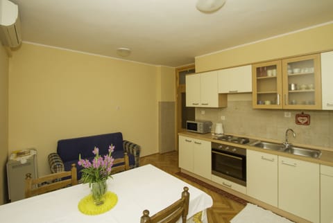 Family Apartment, Garden View | Private kitchen | Fridge, oven, stovetop, coffee/tea maker