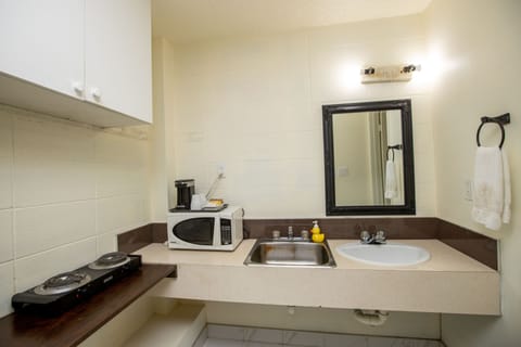 Standard Room, 2 Queen Beds, Smoking | Private kitchen | Fridge, microwave