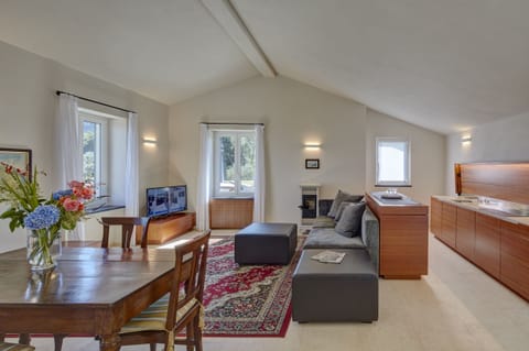 Junior Double or Twin Room | Living area | Flat-screen TV