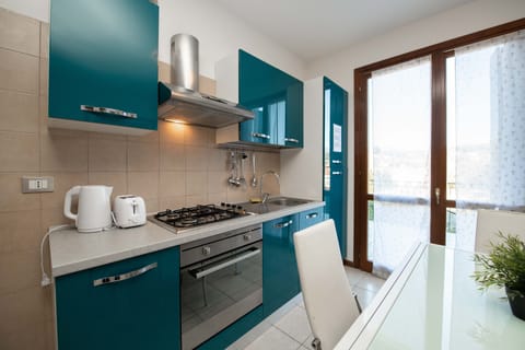 Apartment, 2 Bedrooms (App. 13) | Private kitchen | Full-size fridge, oven, stovetop, coffee/tea maker