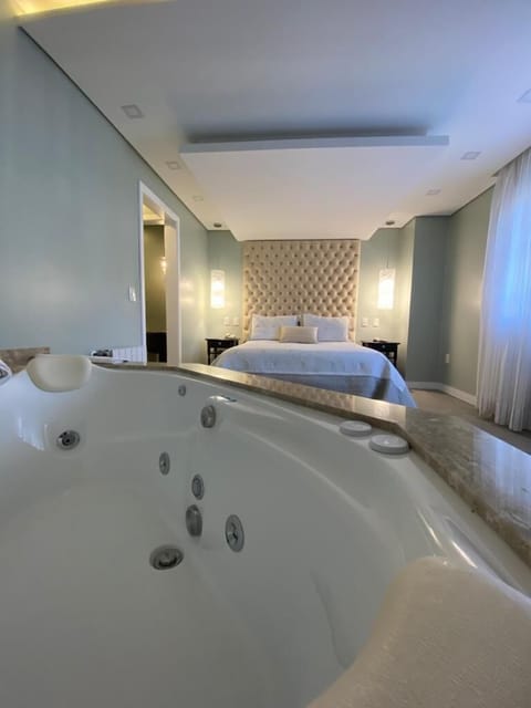 Executive Suite | Bathroom | Designer toiletries, hair dryer, bathrobes, slippers