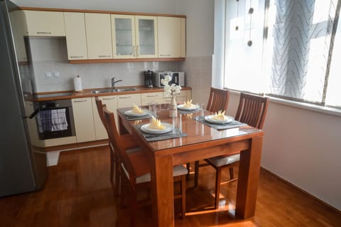 Apartment, City View | Private kitchen | Fridge, espresso maker, coffee/tea maker, dining tables