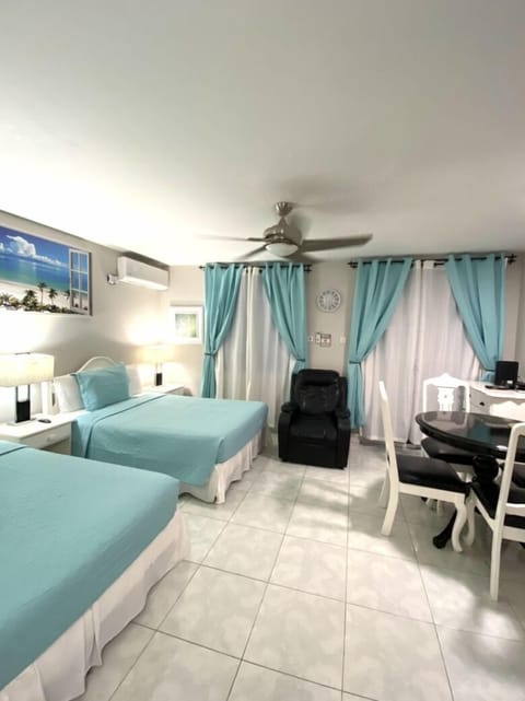 Standard Room, 2 Double Beds | Minibar, in-room safe, individually furnished, desk