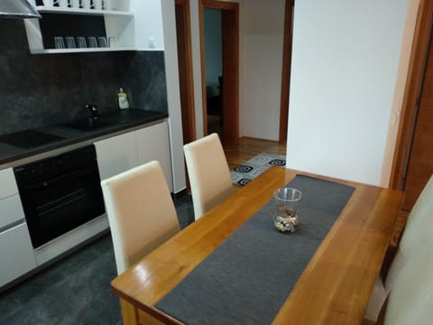 Family Apartment, Multiple Beds, Garden View | In-room dining