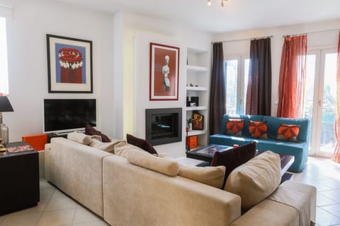 Apartment, 1 Bedroom | Living room | Flat-screen TV