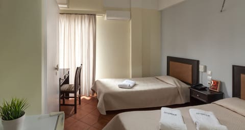 Triple Room, Private Bathroom | Minibar, iron/ironing board, free WiFi, bed sheets