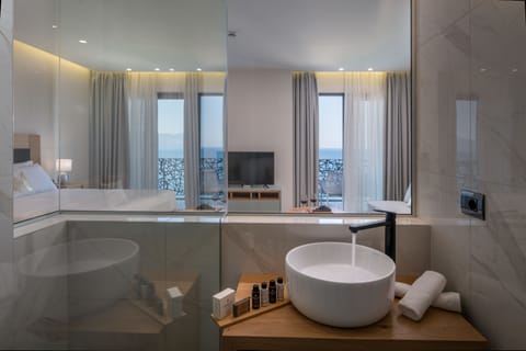 Junior Suite, Balcony, Sea View | Bathroom | Shower, rainfall showerhead, free toiletries, hair dryer