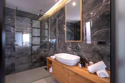 Glow Suite, Terrace, Sea View | Bathroom | Shower, rainfall showerhead, free toiletries, hair dryer