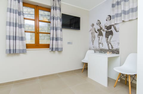 Bed in 4-Bed Dormitory Room with Shared Bathroom | Blackout drapes, soundproofing, iron/ironing board, free WiFi