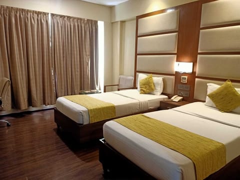 Deluxe Room, 1 Bedroom | Living area | 24-inch LED TV with premium channels, TV, fireplace