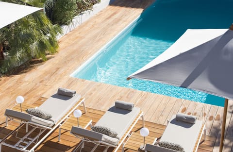 Seasonal outdoor pool, a heated pool, pool umbrellas, sun loungers