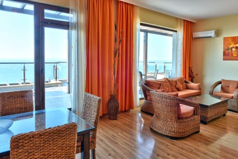 Deluxe Apartment, 2 Bedrooms, Sea View | Living area | Flat-screen TV