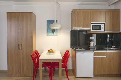 City Apartment, City View | Private kitchenette | Fridge, microwave, stovetop, coffee/tea maker