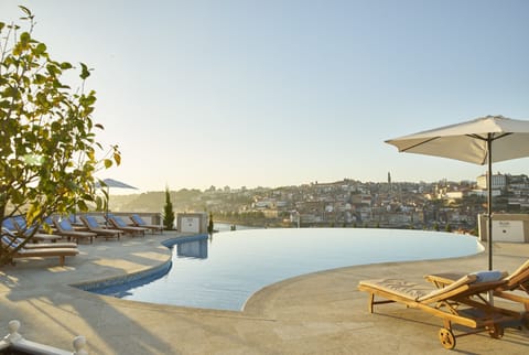 Indoor pool, seasonal outdoor pool, pool umbrellas, sun loungers