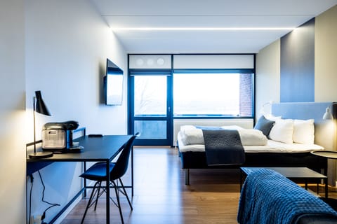 Deluxe Quadruple Room, Balcony | Individually decorated, individually furnished, desk, laptop workspace