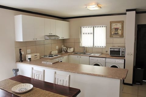 Family Apartment, Non Smoking, Pool Access | Private kitchen | Full-size fridge, microwave, oven, stovetop