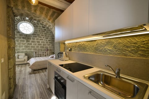 Apartment (Chiesetta Rosa) | Private kitchen | Full-size fridge, stovetop, espresso maker, cookware/dishes/utensils