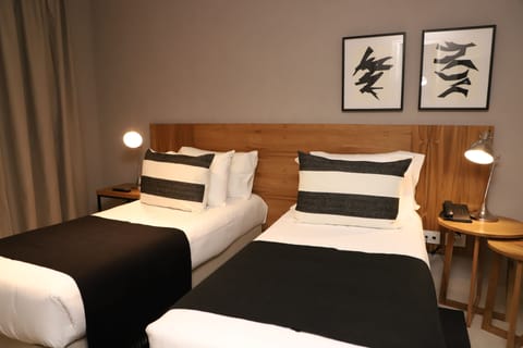 Standard Twin Room | Minibar, in-room safe, iron/ironing board, free WiFi