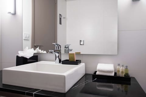 Combined shower/tub, designer toiletries, hair dryer, bathrobes