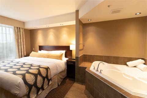 Suite, 1 King Bed, Jetted Tub | Premium bedding, down comforters, pillowtop beds, desk