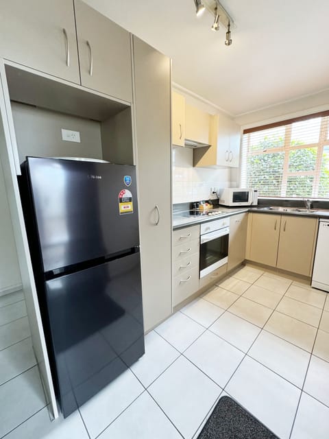 Large One Bedroom Suite | Private kitchen | Full-size fridge, microwave, oven, stovetop