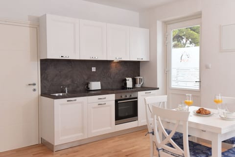 Premium Studio, Sea View | Private kitchen | Full-size fridge, stovetop, coffee/tea maker, electric kettle