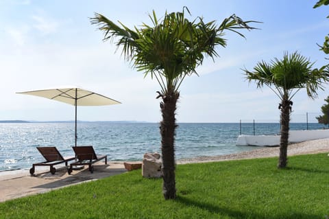 Private beach, white sand, sun loungers, beach umbrellas