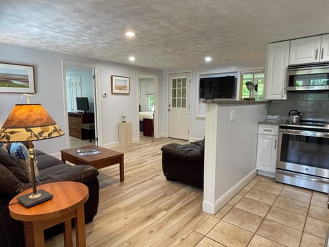 Lower Deluxe Two Bedroom Cottage | Living area | Flat-screen TV, DVD player