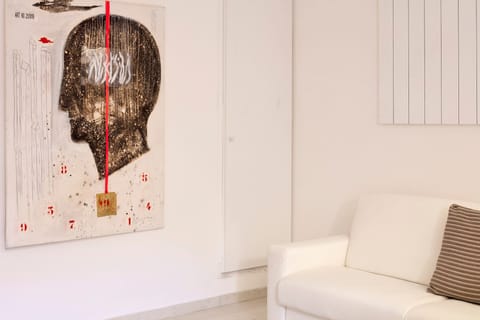 Deluxe Quadruple Room (Era) | Living area | 30-inch Smart TV with digital channels