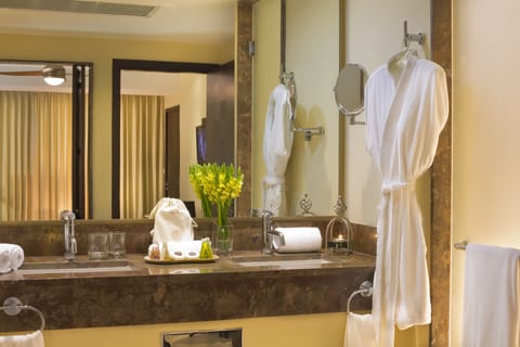 Separate tub and shower, designer toiletries, hair dryer, bathrobes