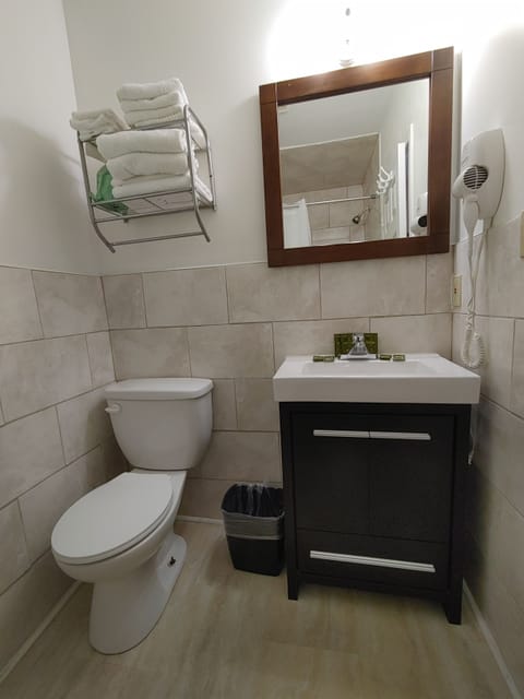 Standard Room with 2 Queen Beds | Bathroom | Shower, free toiletries, hair dryer, towels