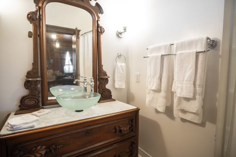 The Riley Suite | Bathroom | Combined shower/tub, hair dryer, towels, soap