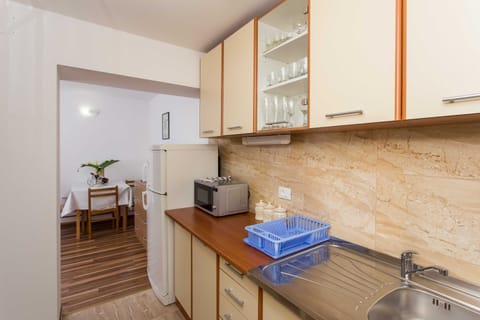 Apartment (One-Bedroom Apartment with Shared Ter) | Private kitchen | Fridge, oven, stovetop, electric kettle