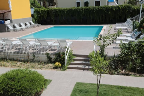 Seasonal outdoor pool, a rooftop pool, pool umbrellas, sun loungers