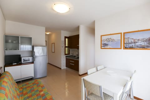 Apartment, 1 Bedroom | Living area | 22-inch TV with satellite channels