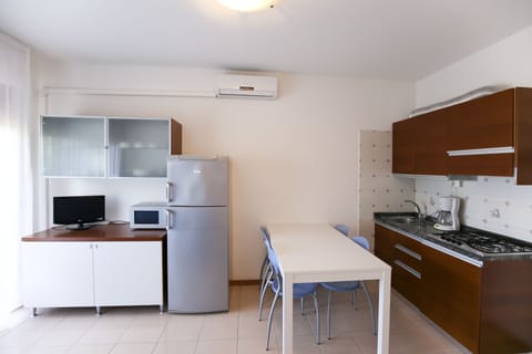 Apartment, 1 Bedroom | Private kitchen | Full-size fridge, cookware/dishes/utensils