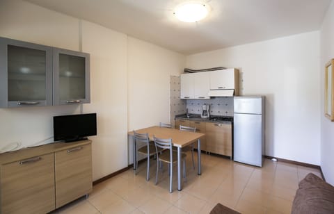 Apartment, 1 Bedroom | Private kitchen | Full-size fridge, cookware/dishes/utensils